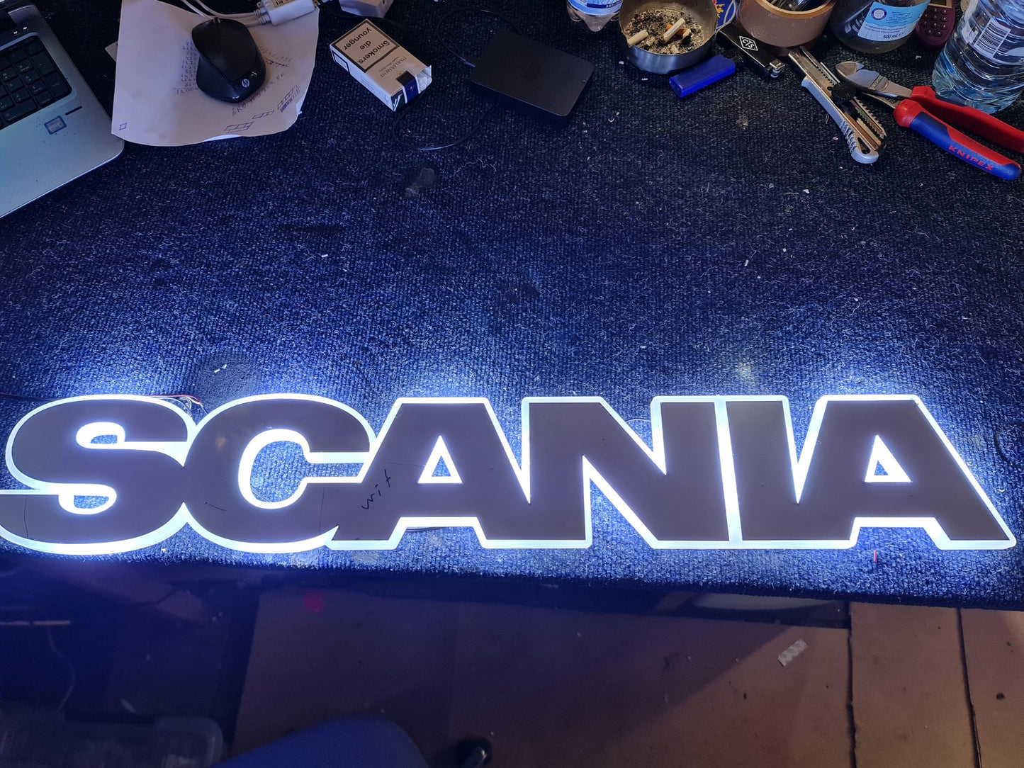 Scania letter grille logo in white